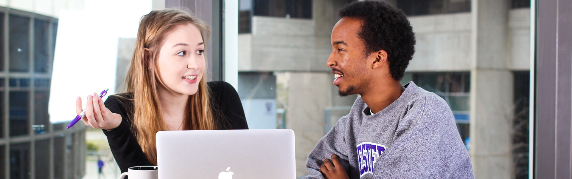 Students studying together in a building on campus